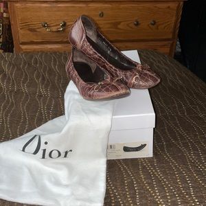 Christian Dior “Cannage Ballerine” quilted brown leather flats.